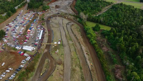 Aerial-Overhead-View-Motor-Race-On-Muddy-Racetrack-At-Frutillar,-Los-Lagos-Region,-Chile