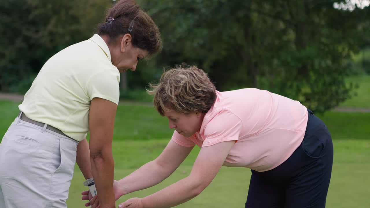 Woman golfing on a golf course