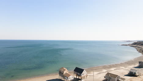 Aerial-Drone-shot-of-beach-houses-at-Peggotty-Beach,-Scituate,-Massachusetts