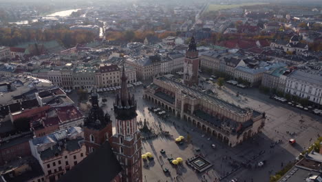 Saint-Mary-Basilica-and-Cloth-Hall,-Krakow-Market-Square-AERIAL-DRONE