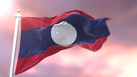 flag of laos waving at wind at sunset in slow, loop