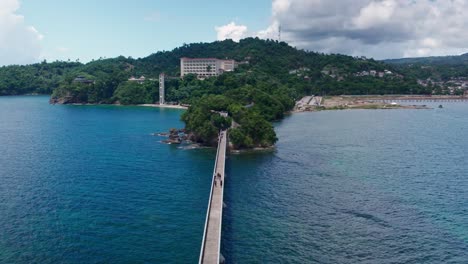 aerial view of tropical island resort with bridge and beach