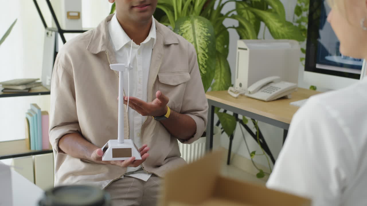 Environmental Specialists Discussing Work of Wind Turbine