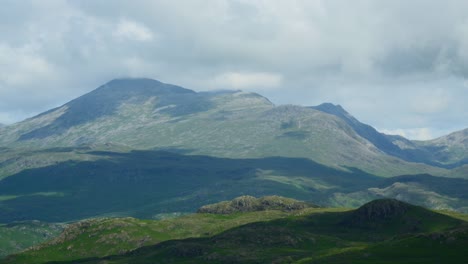 Thick-cloud-skimming-mountain-tops-as-cloud-shadows-race-across-the-countryside