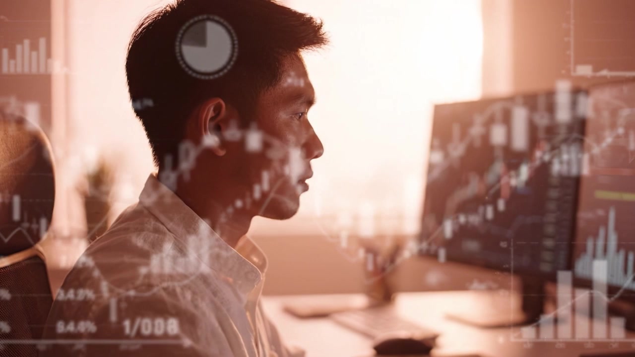Focused individual analyzing financial data on multiple monitors in a warm-toned office environment, reflecting diligent investment strategies and market trends.