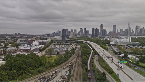 Jersey-City-New-Jersey-Aerial-v15-drone-flyover-train-yard-in-Communipaw-towards-Harbor-park-capturing-Science-Museum,-downtown-cityscape-and-NYC-views---Shot-with-Mavic-3-Pro-Cine---September-2023