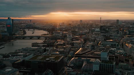 aerial view of london skyline at sunset looking down the river thames to include st paul's cathedral