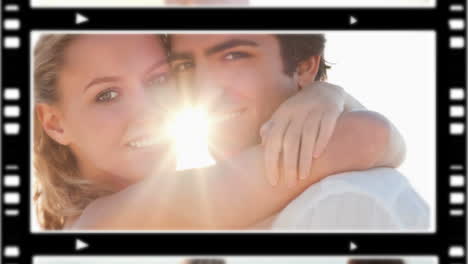 una pareja feliz de pie en la playa.
