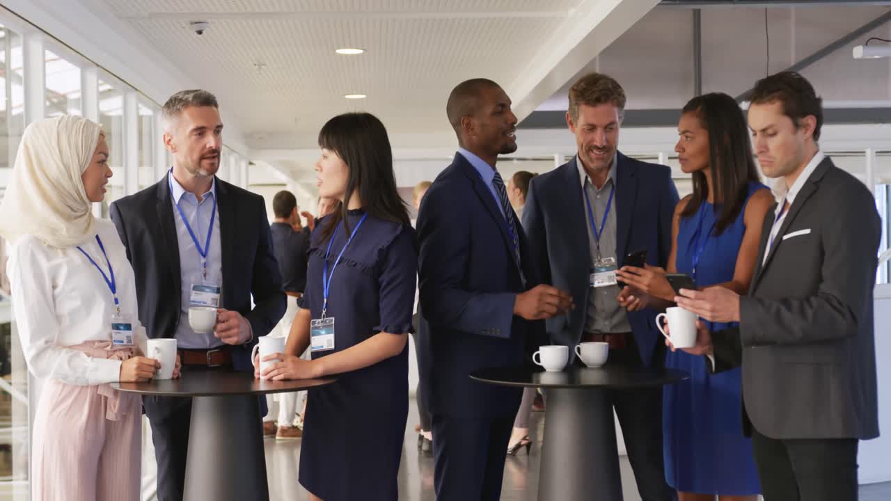 Business people talking during a coffee break at a convention