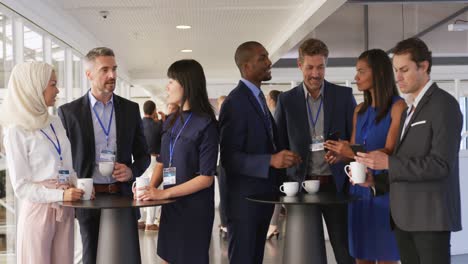 business people talking during a coffee break at a convention