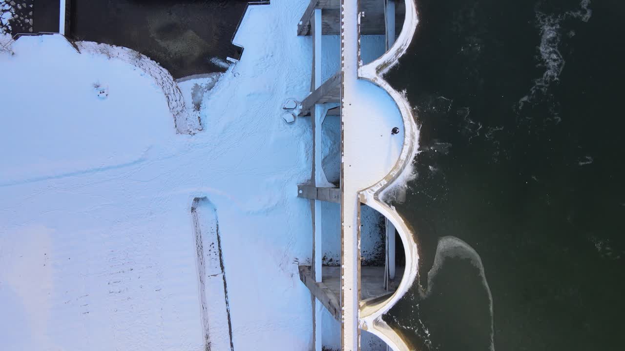 Top view of the concrete structure of the frozen Linachtalsperre dam in Black Forest, Germany