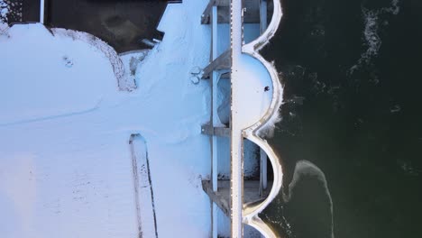 top view of the concrete structure of the frozen linachtalsperre dam in black forest, germany