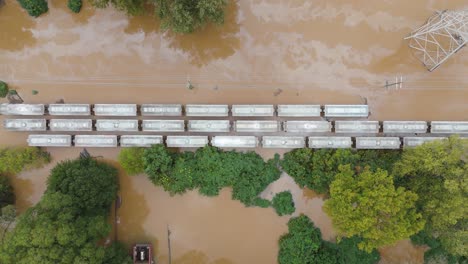 drone shot of a flooded train from hurricane helene and the chattahoochee river in atlanta, georgia.
