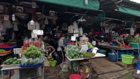 vendors and shoppers in a busy market scene