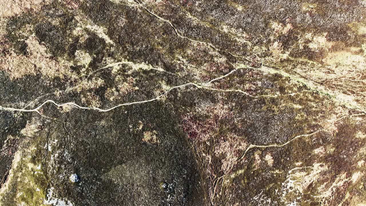 Ireland Epic drone landscapes flying slowly over heathland with trails Comeragh Mountains Waterford