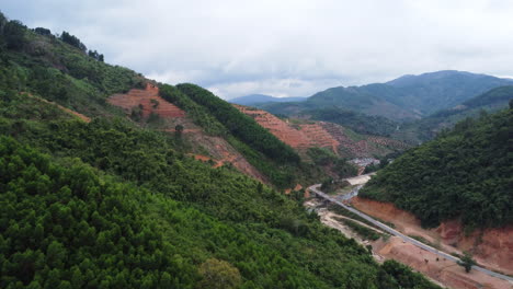 aerial flying over deforested mountain slopes, vietnam