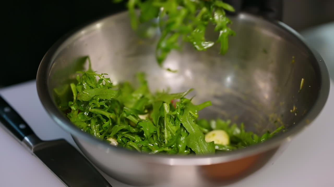 Preparing food in restaurant kitchen. Cooking vegetarian food at modern restaurant kitchen