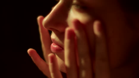 Woman applying cosmetics