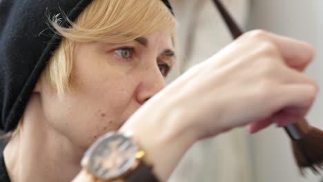 makeup artist applying makeup