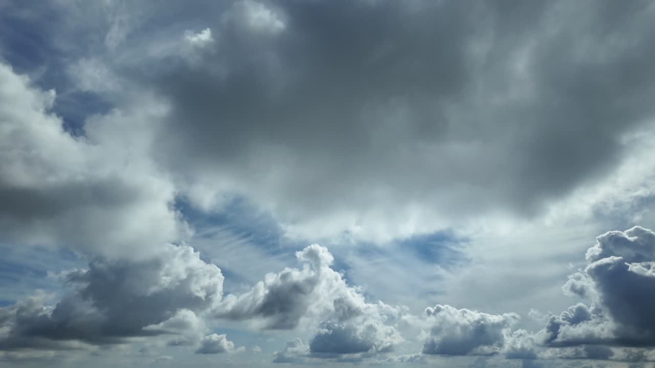 A supersonic speed flight experience from inside a jet airplane while flying at supersonic speed under a layer of cottony cumulus clouds, with a radiant sun shining above. Ultra-realistic 4K scene.