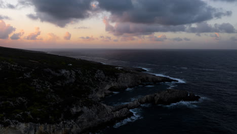 coastal sunrise/sunset over rocky shore