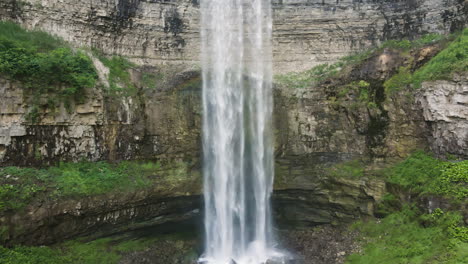 aerial rising from base of cascading ribbon falls from tew waterfall canada