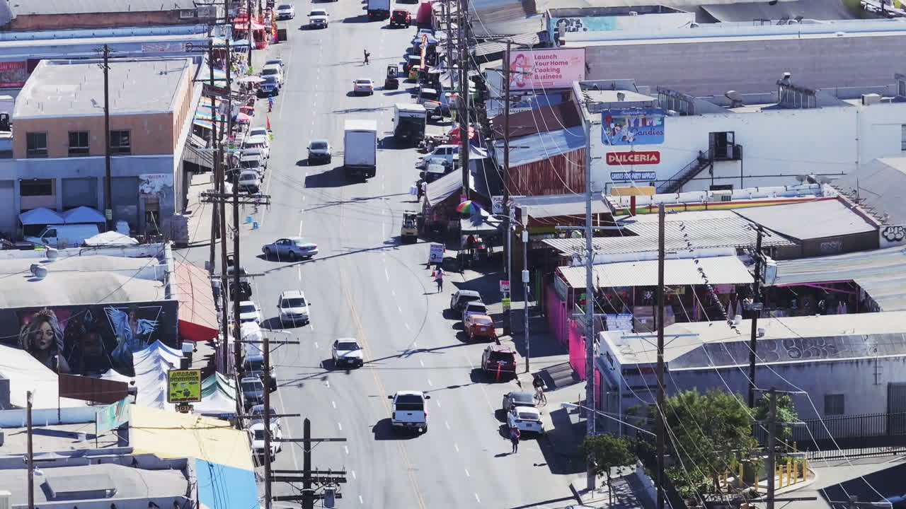Busy Urban Street with Traffic and Commercial Buildings