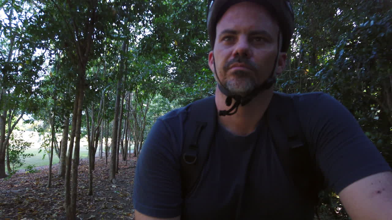 guy riding bike close up smiling