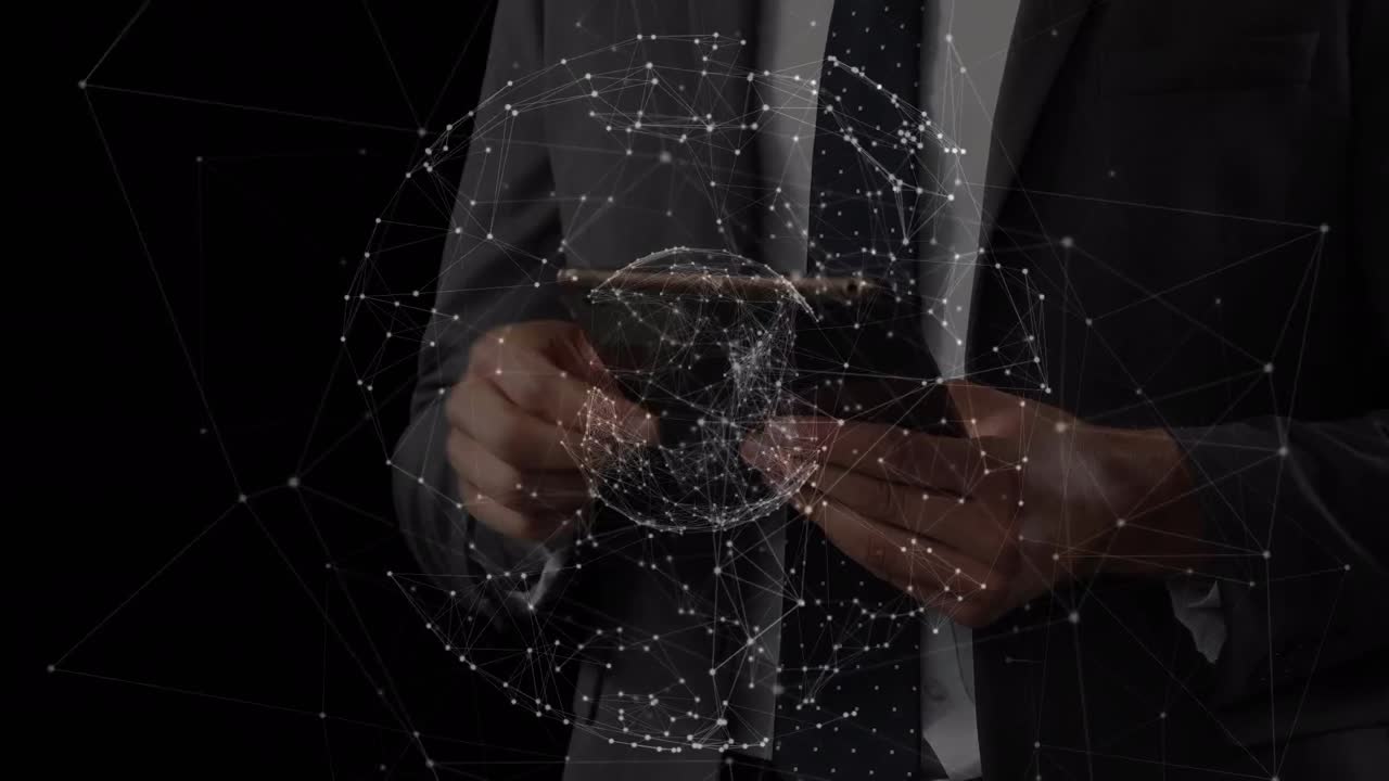 Animation of globe of connections over caucasian businessman using tablet