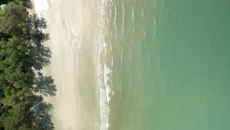 Aerial-birds-eye-view-down-shot-of-pristine-tropical-beach-in-Thailand