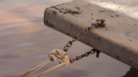Closeup-Shot-Of-A-Rope-And-Chain-Used-To-Moore-Boats-At-A-Harbor-Dock