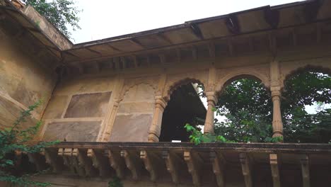 pan shot of architecture of an old abandoned heritage building or haveli in india