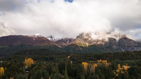 a mountain of clouds runs along lopez hill in bariloche, argentina during autumn