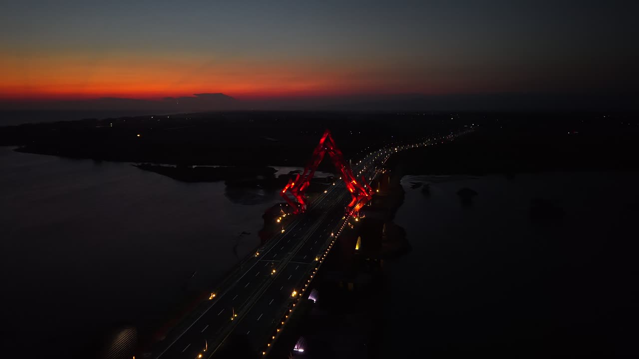 Aerial view of the Pandansimo Bridge at sunset, Bantul, Yogyakarta, as part of the southern ring road route of Java