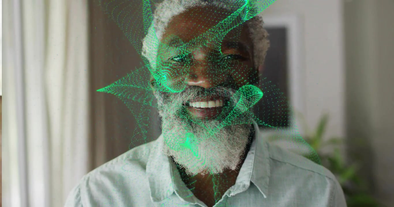 Senior man in home green digital mesh emerging and scanning contours while smiling for technology