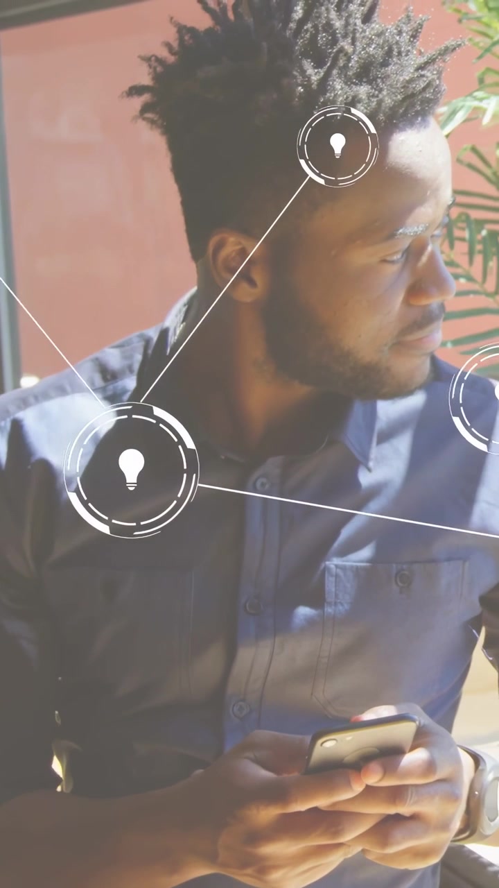 Adult man sitting by window, scrolling phone, sparking idea icons tracking plant for tech insight