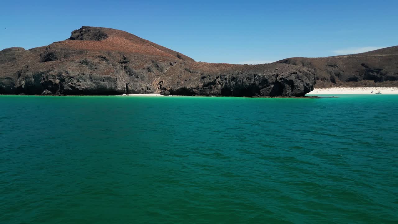 Tecolandra beach with turquoise waters and rocky cliffs, baja california sur, aerial view
