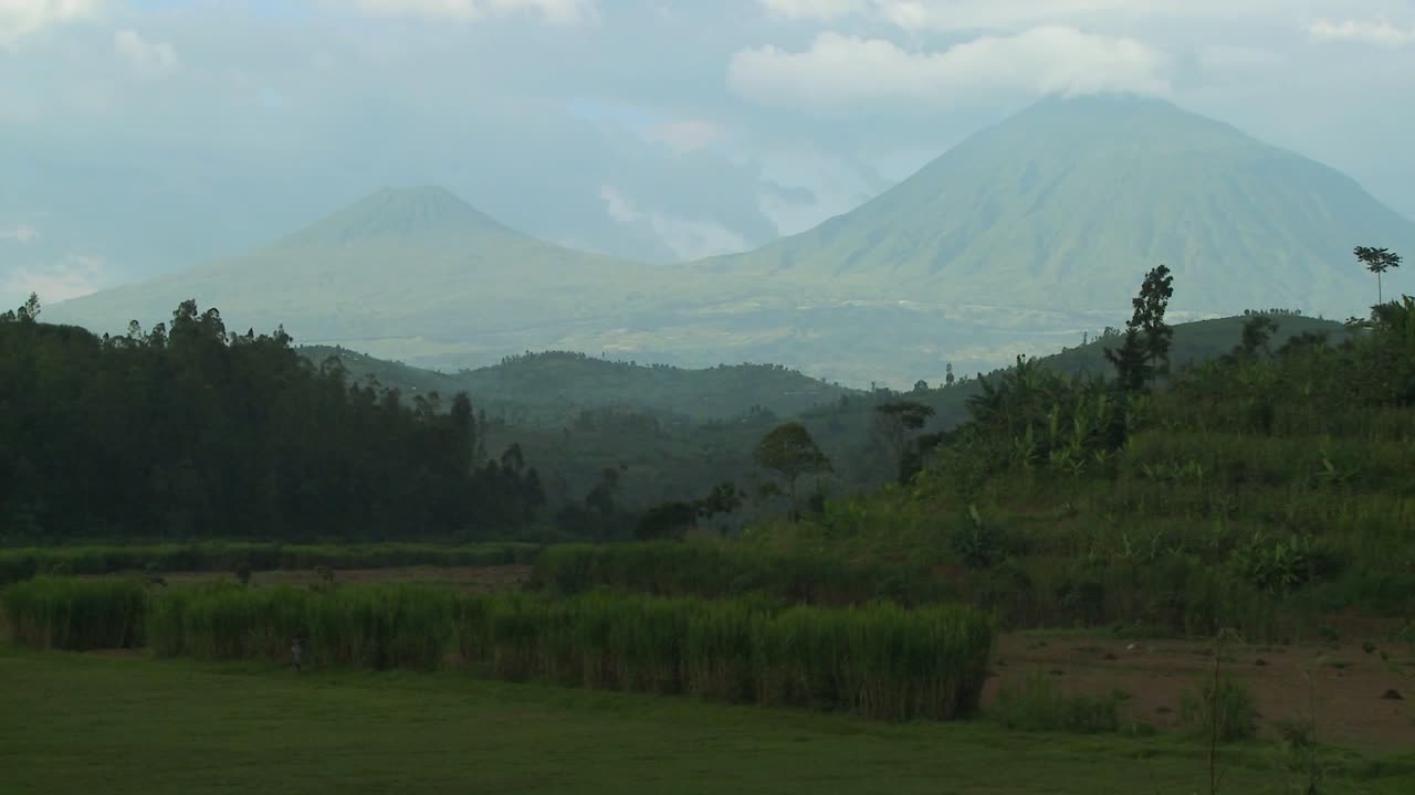 Premium stock video - Establishing shot of the virunga volcanos on the ...