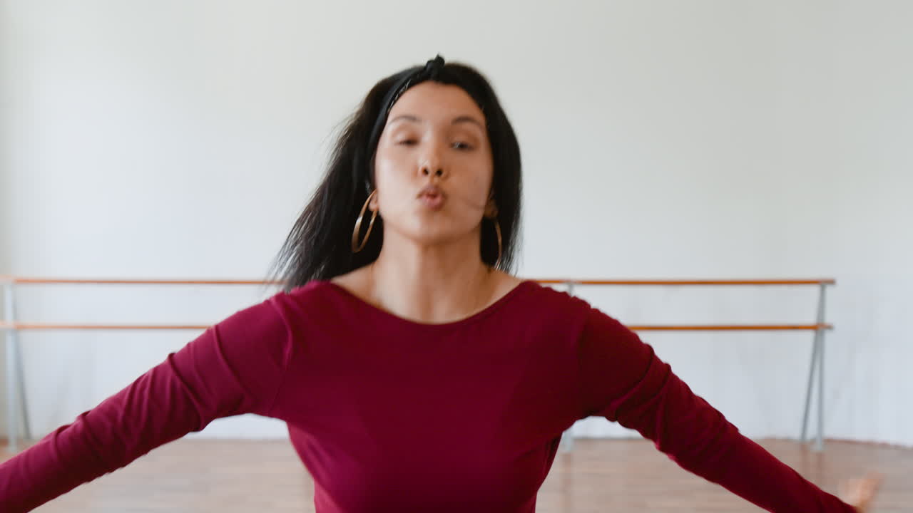 Woman practicing expressive dance in a studio