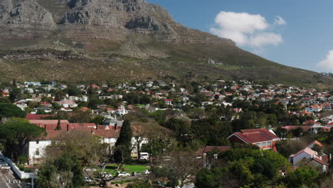drone shot over suburb on table mountain in cape town, south africa