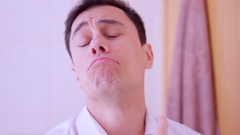 businessman applying perfume and enjoying fragrance