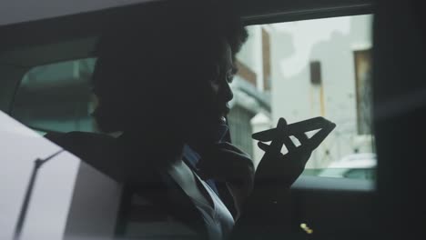 African-american-woman-wearing-face-mask-in-car