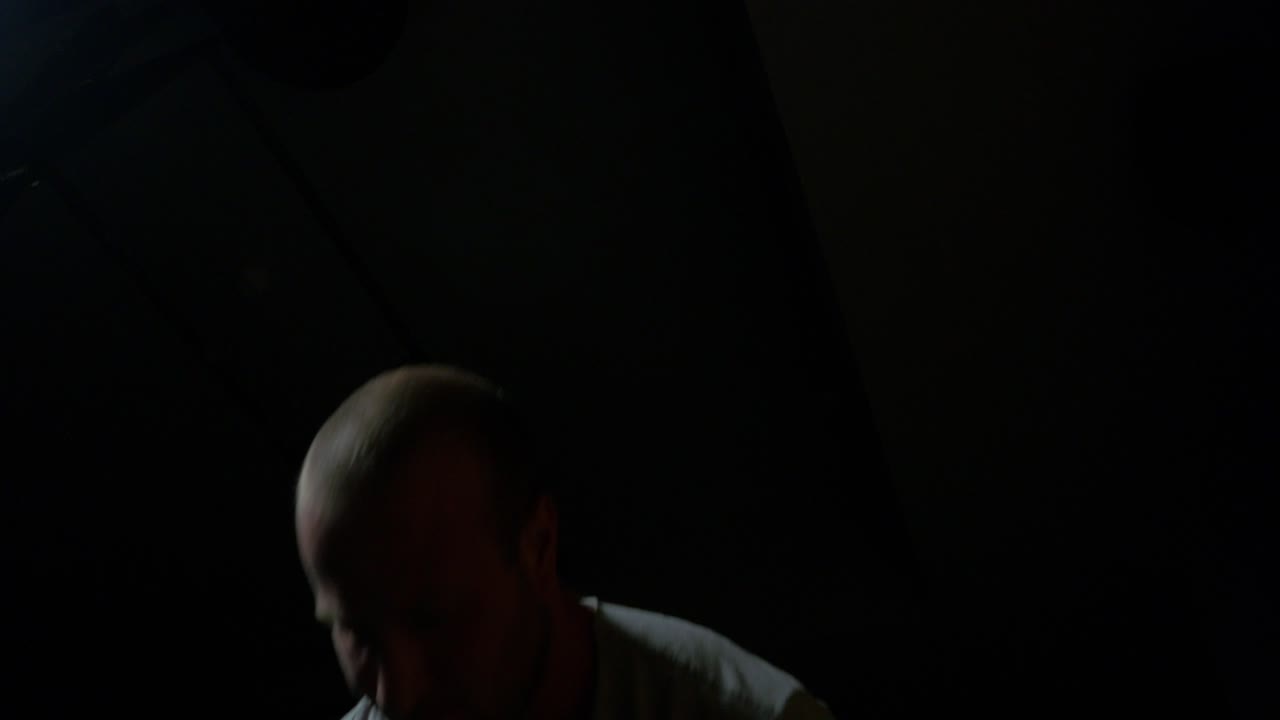 Man Performing Kettlebell Swings