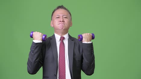 mature japanese businessman exercising