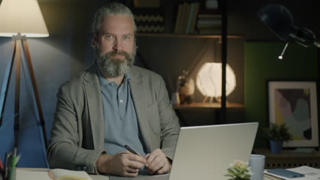 man working late at home office