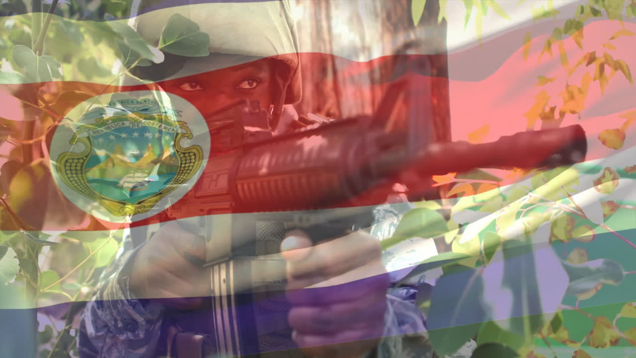 Aiming rifle through foliage, soldier with flag overlay and emblem visible