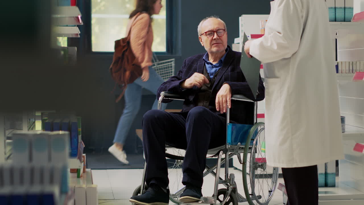 Elderly man in wheelchair at a pharmacy