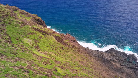 stunning aerial shot flying over coast on oahu island, hawaii