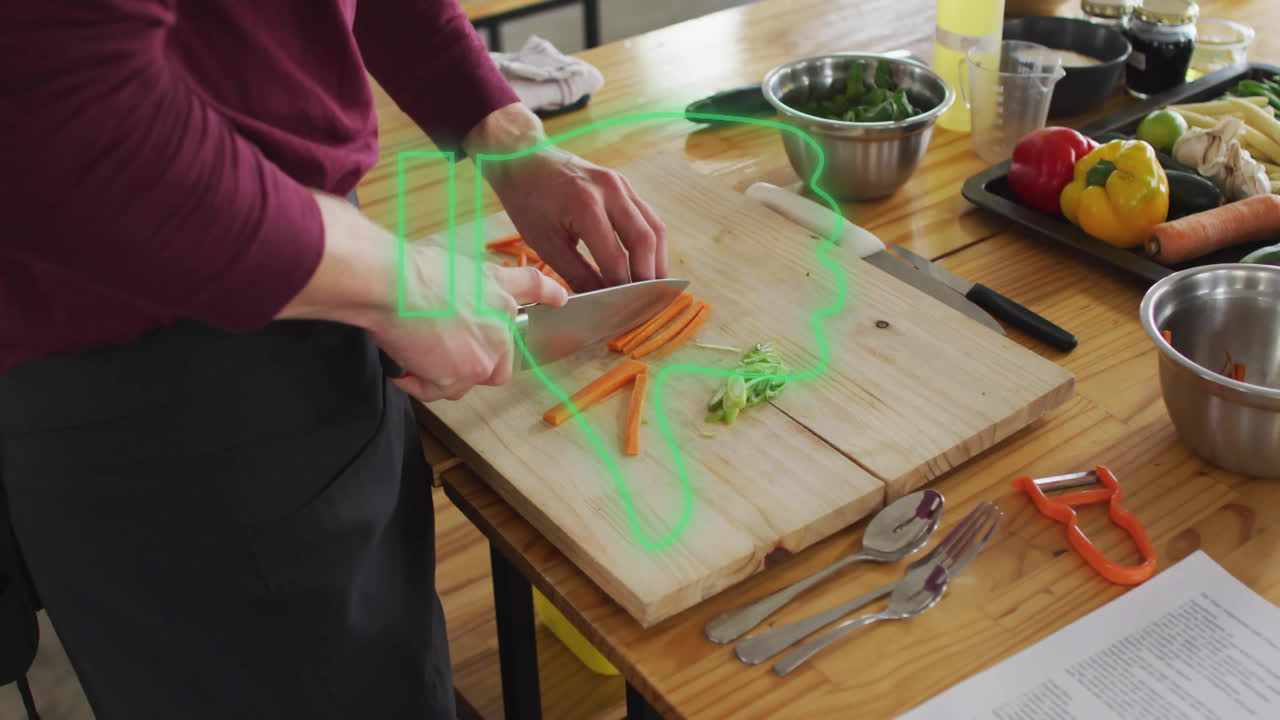 Person slicing carrots on cutting board with green outline animation overlay