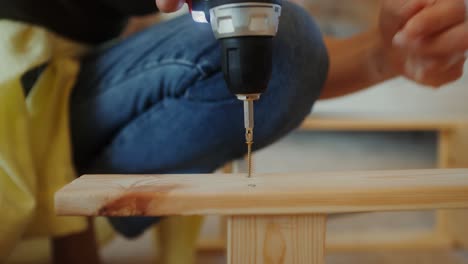 assembling wooden furniture with a power drill